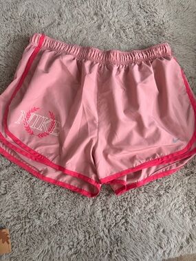 Nike Women’s Light Pink Athletic Shorts with Hot Pink Trim